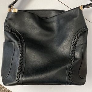 Black leather shoulder bag with gold accents